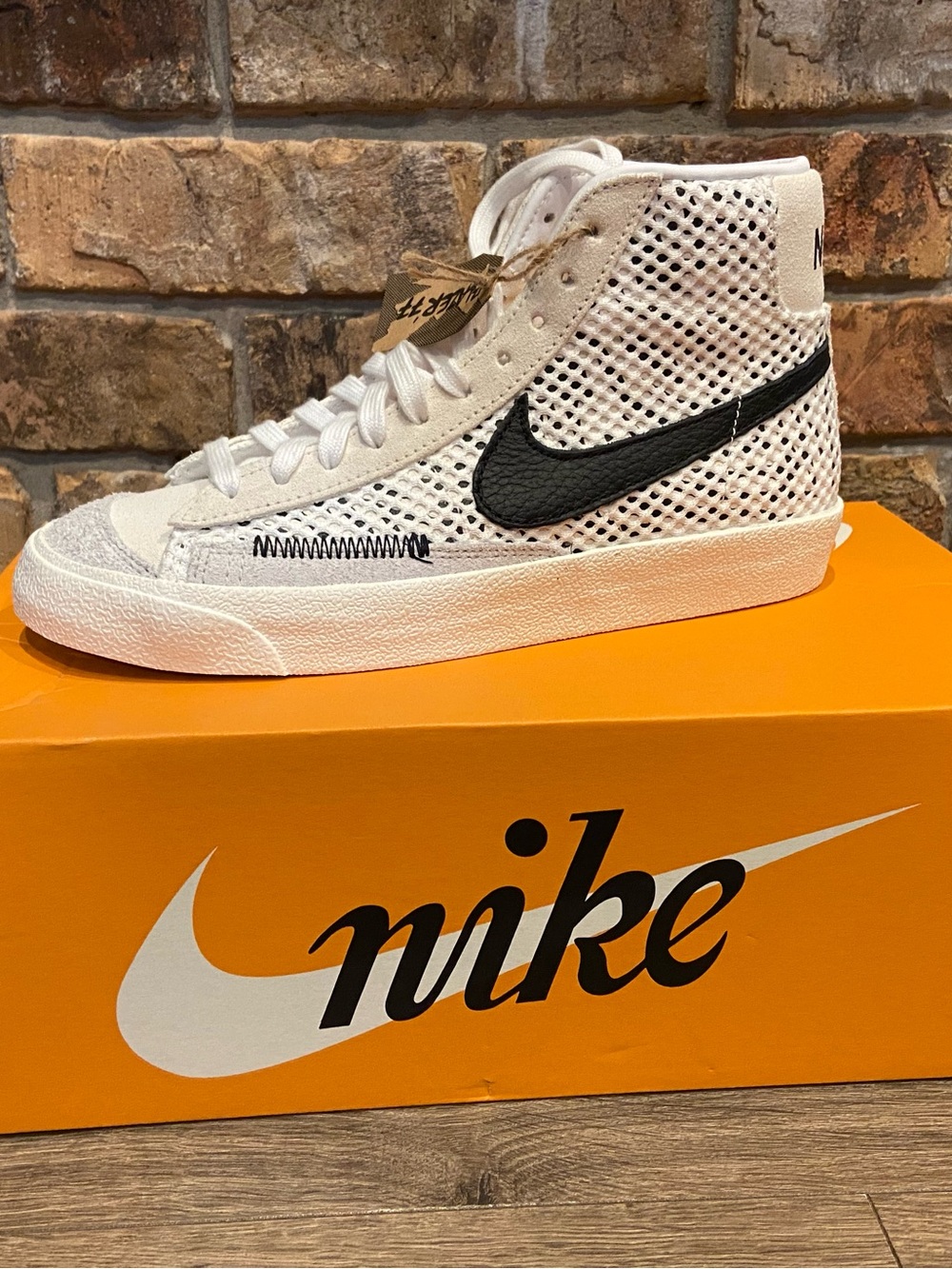 Nike High-Top Perforated White Sneaker with Black Swoosh
